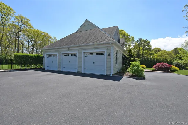 a view of a house with a yard and garage
