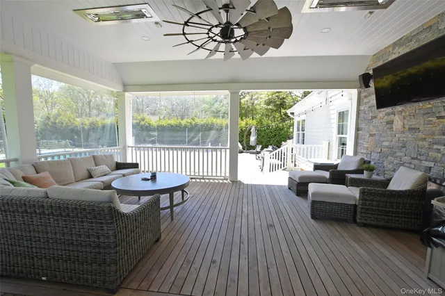 a living room with fireplace furniture and a flat screen tv