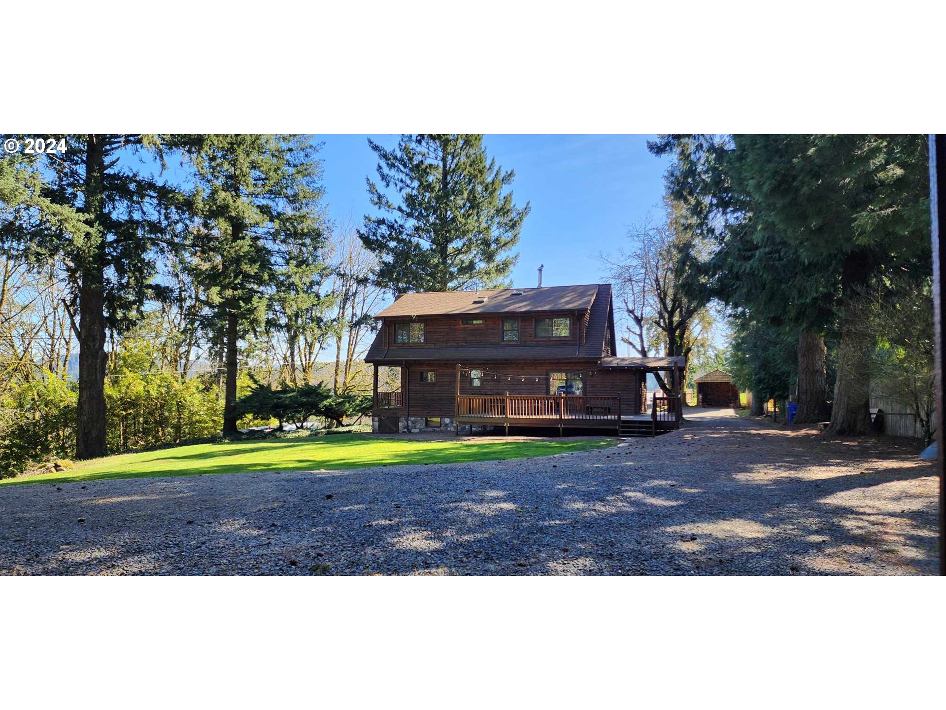 16441 South Henrici Road Oregon City, OR 97045 - Photo 30 of 41 a view of a big house with a big yard and large trees