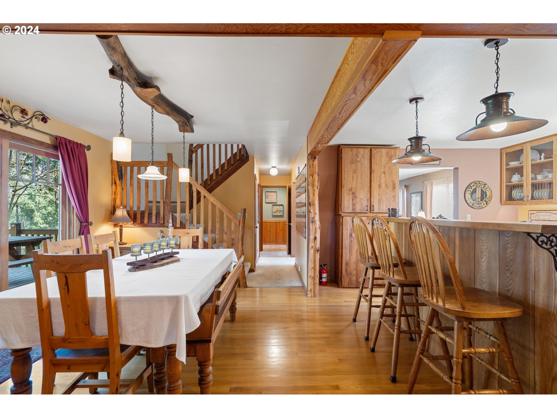 16441 South Henrici Road Oregon City, OR 97045 - Photo 3 of 41 a dining room with furniture and wooden floor