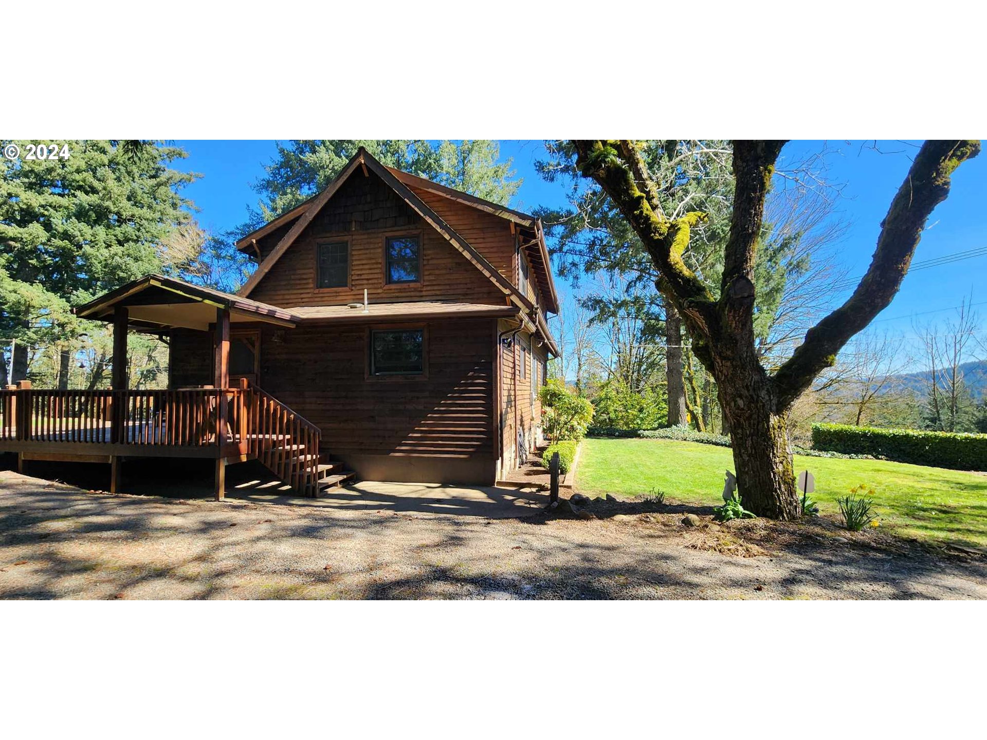 16441 South Henrici Road Oregon City, OR 97045 - Photo 32 of 41 a view of a house with backyard and trees