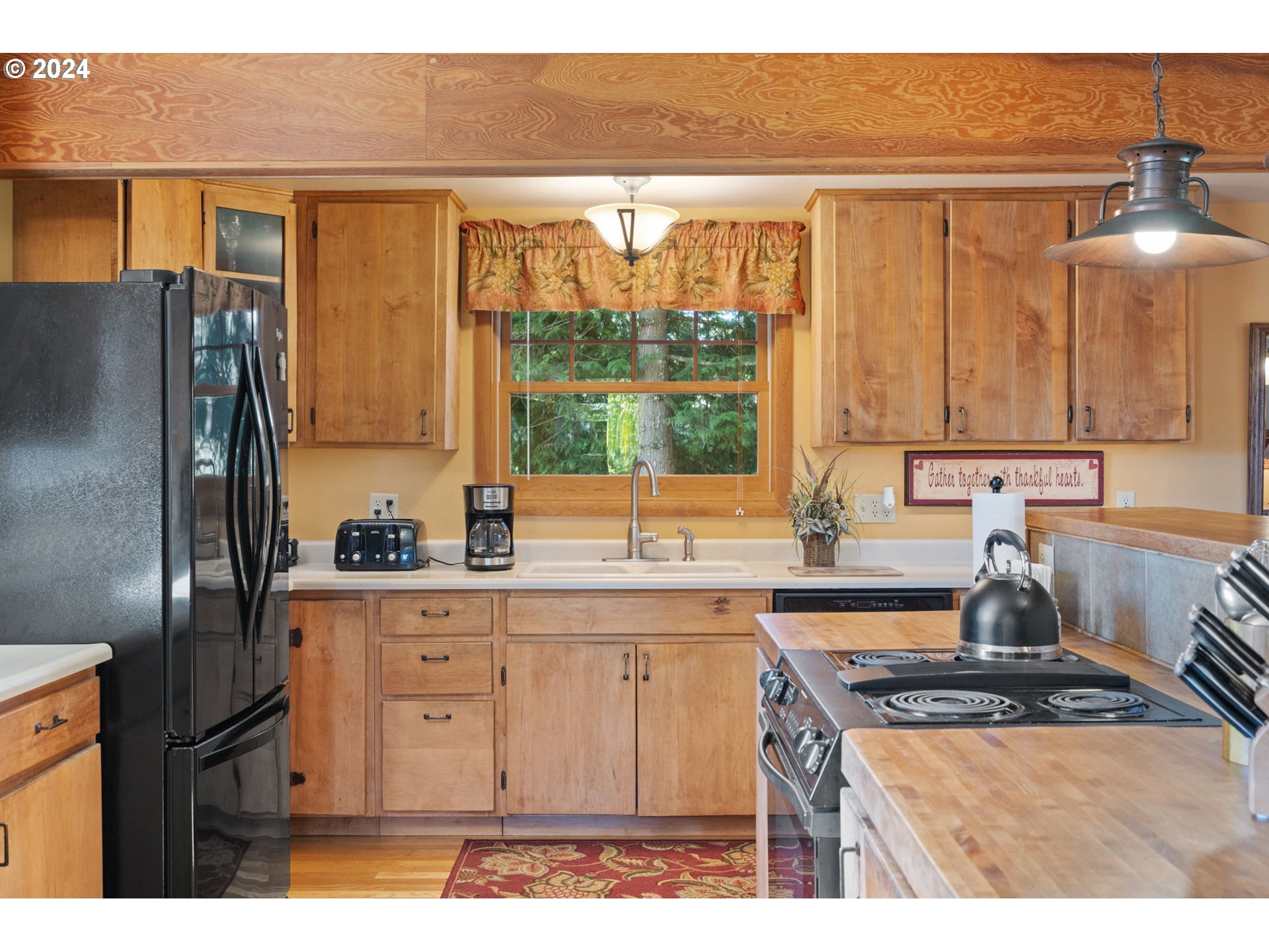 16441 South Henrici Road Oregon City, OR 97045 - Photo 7 of 41 a kitchen with stainless steel appliances granite countertop a stove a sink and a refrigerator