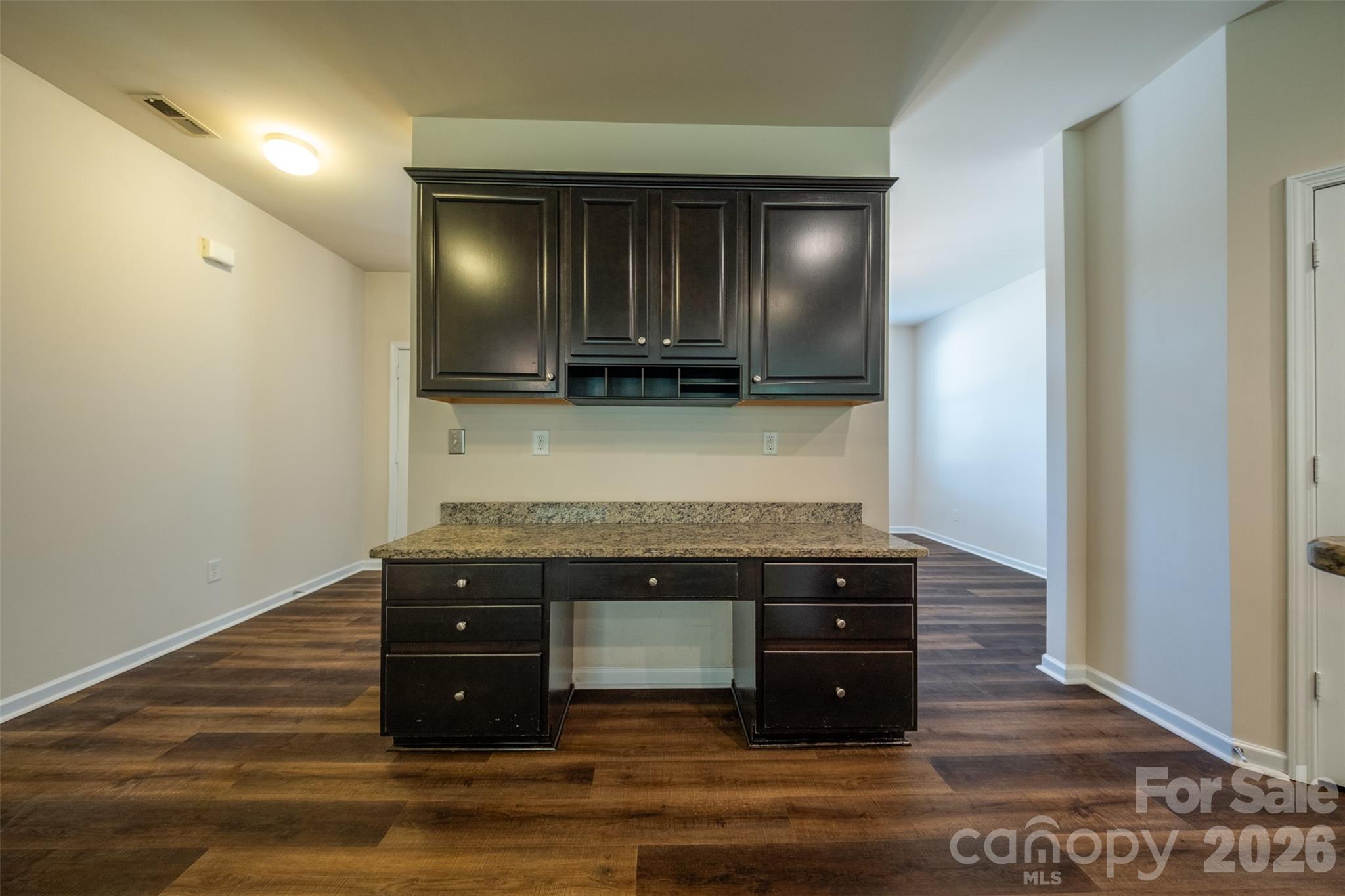 3006 Houndscroft Road Indian Trail, NC 28079 - Photo 9 of 39 a view of a kitchen counter space and wooden floor