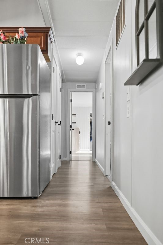 34164 Harrow Hill Road Wildomar, CA 92595 - Photo 11 of 60 a view of a hallway with wooden floor
