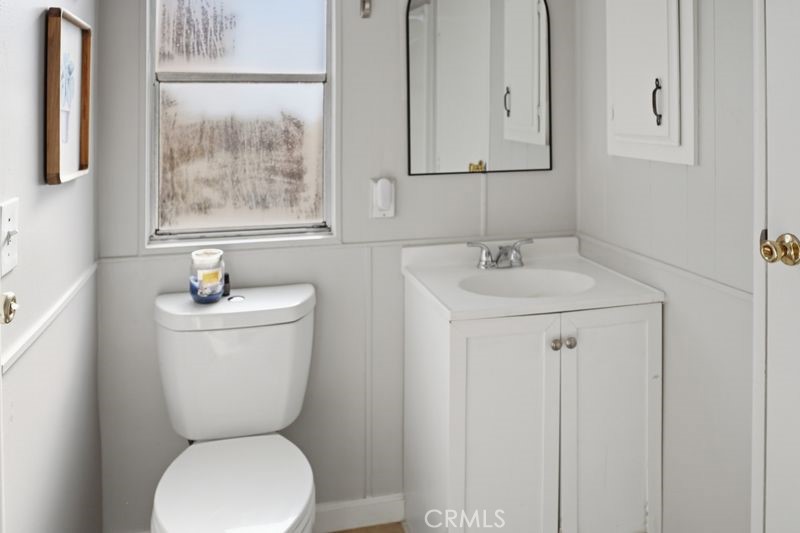 34164 Harrow Hill Road Wildomar, CA 92595 - Photo 14 of 60 a bathroom with a toilet sink and mirror