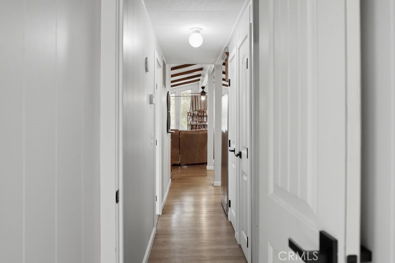 34164 Harrow Hill Road Wildomar, CA 92595 - Photo 20 of 60 a view of a hallway with wooden floor