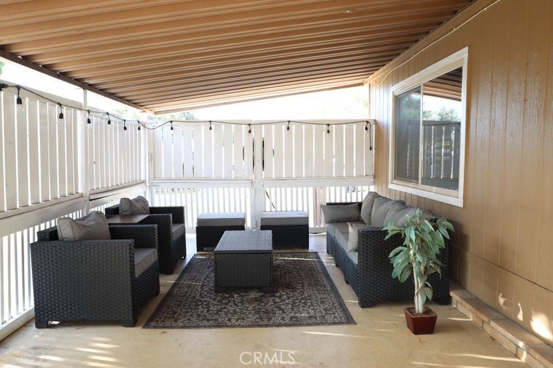 34164 Harrow Hill Road Wildomar, CA 92595 - Photo 28 of 60 a living room with furniture and a potted plant