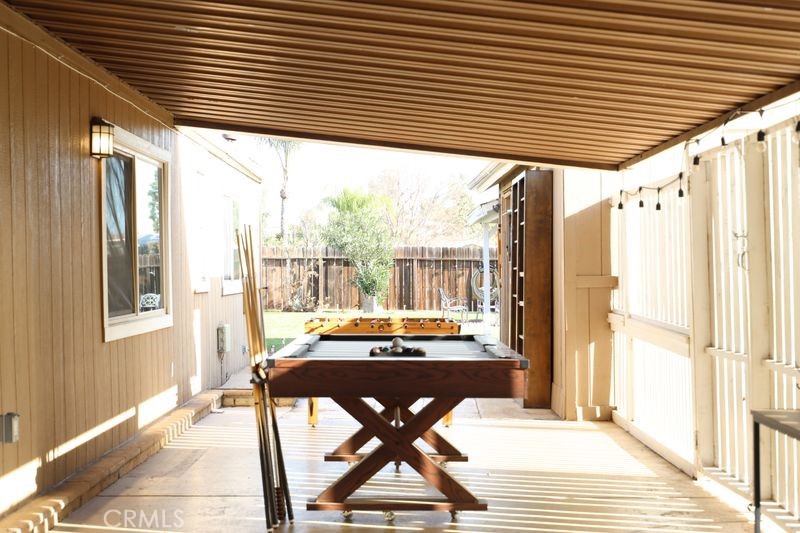 34164 Harrow Hill Road Wildomar, CA 92595 - Photo 29 of 60 a living room with a table or chairs and potted plant