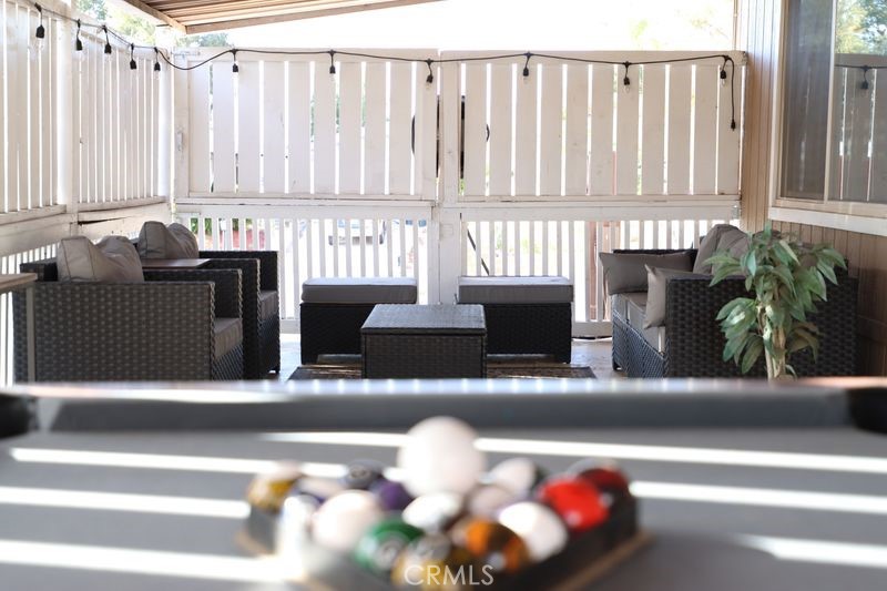 34164 Harrow Hill Road Wildomar, CA 92595 - Photo 32 of 60 a living room with furniture and a potted plant