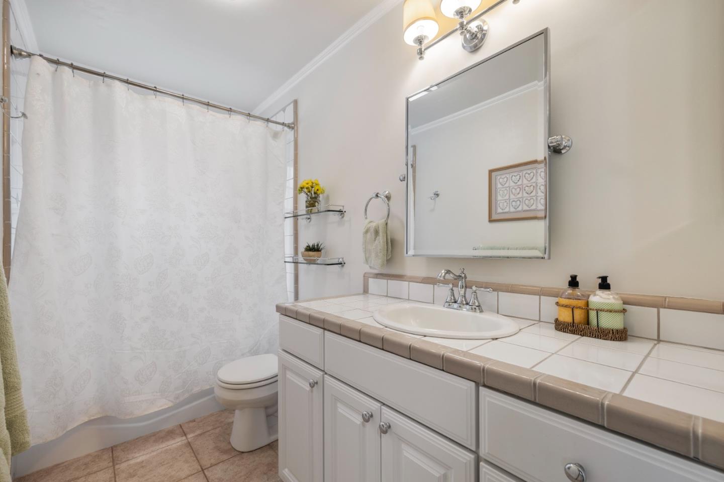 261 Cherry Lane Campbell, CA 95008 - Photo 20 of 49 a bathroom with a granite countertop sink a toilet and mirror