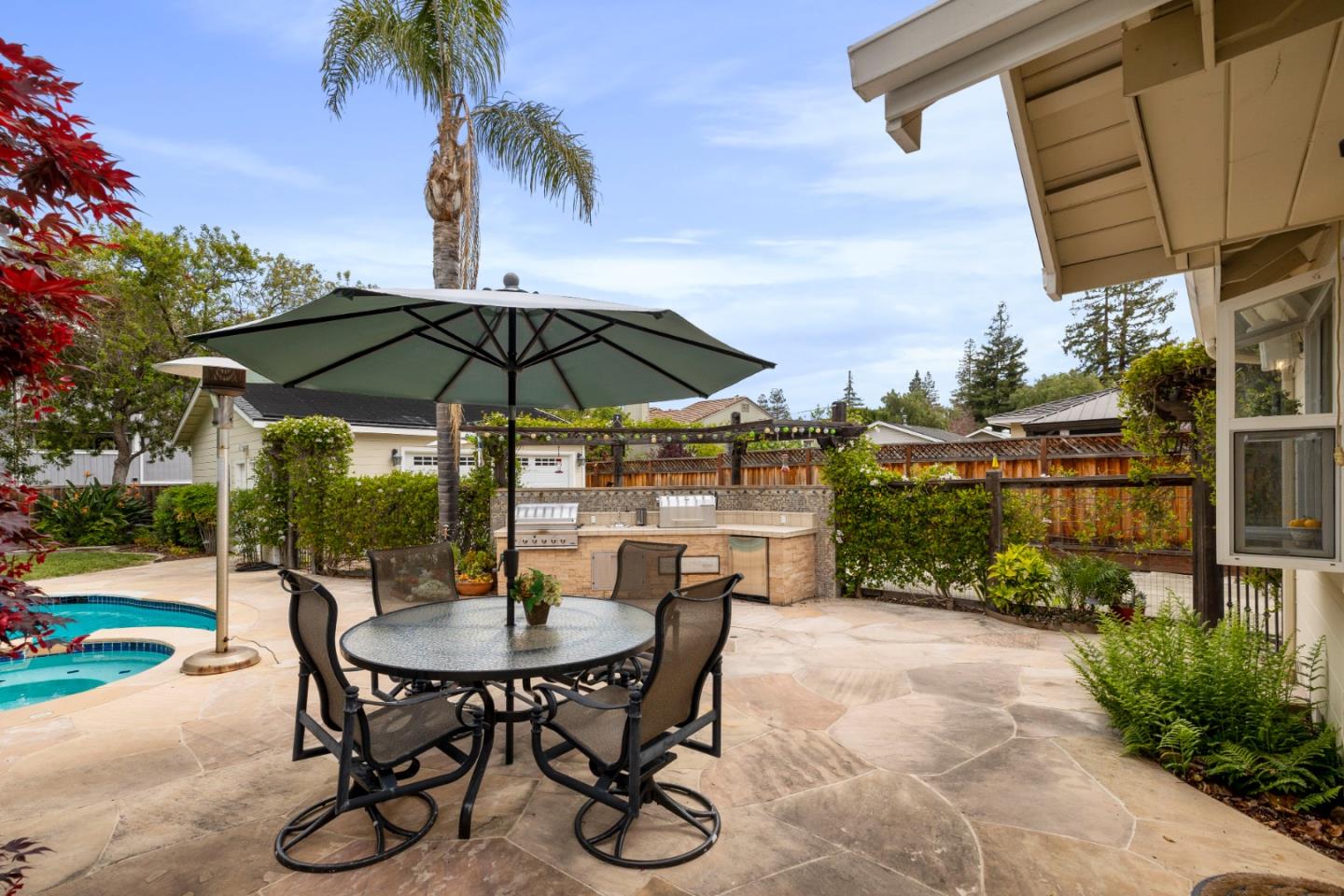 261 Cherry Lane Campbell, CA 95008 - Photo 28 of 49 a patio with a patio table and chairs