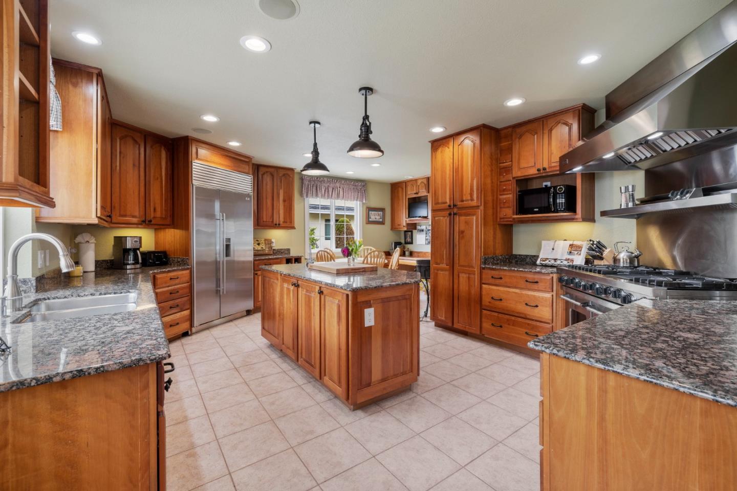 261 Cherry Lane Campbell, CA 95008 - Photo 6 of 49 a kitchen with stainless steel appliances granite countertop a stove a sink a oven and a refrigerator