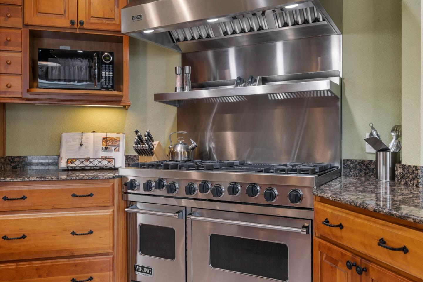 261 Cherry Lane Campbell, CA 95008 - Photo 8 of 49 a stove top oven sitting inside of a kitchen