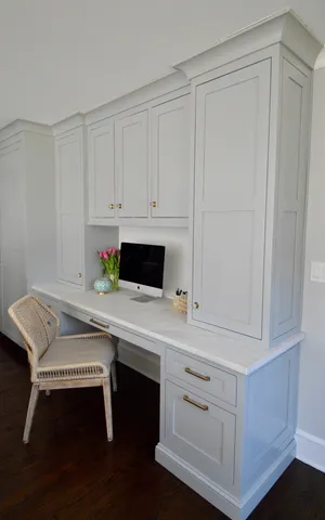 a bathroom with a sink vanity and mirror