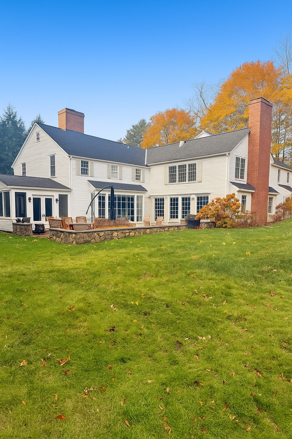142 Brookside Road Darien, CT 06820 - Photo 15 of 18 a front view of a house with a garden and plants