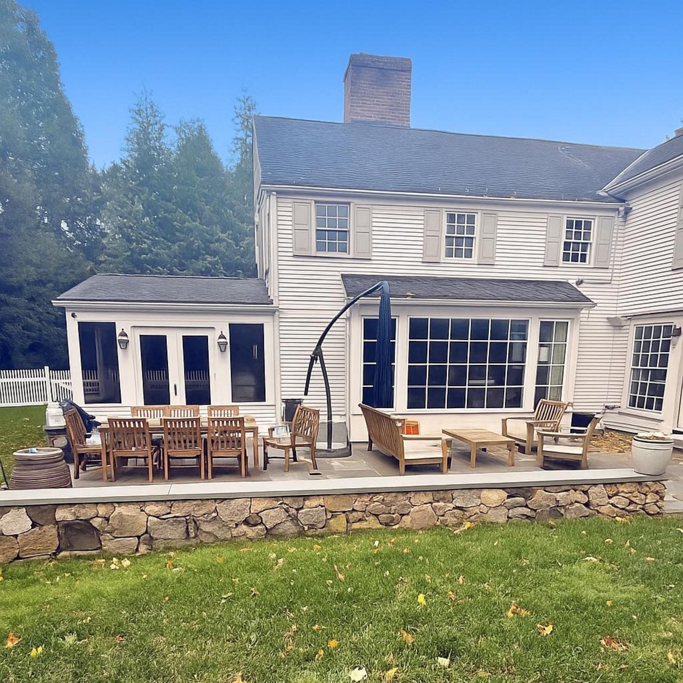 142 Brookside Road Darien, CT 06820 - Photo 16 of 18 a front view of a house with a yard