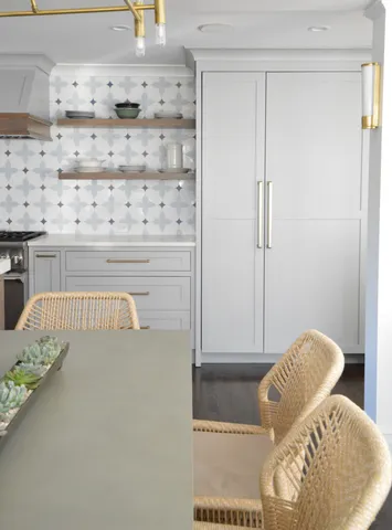 a kitchen with a sink cabinets and a window