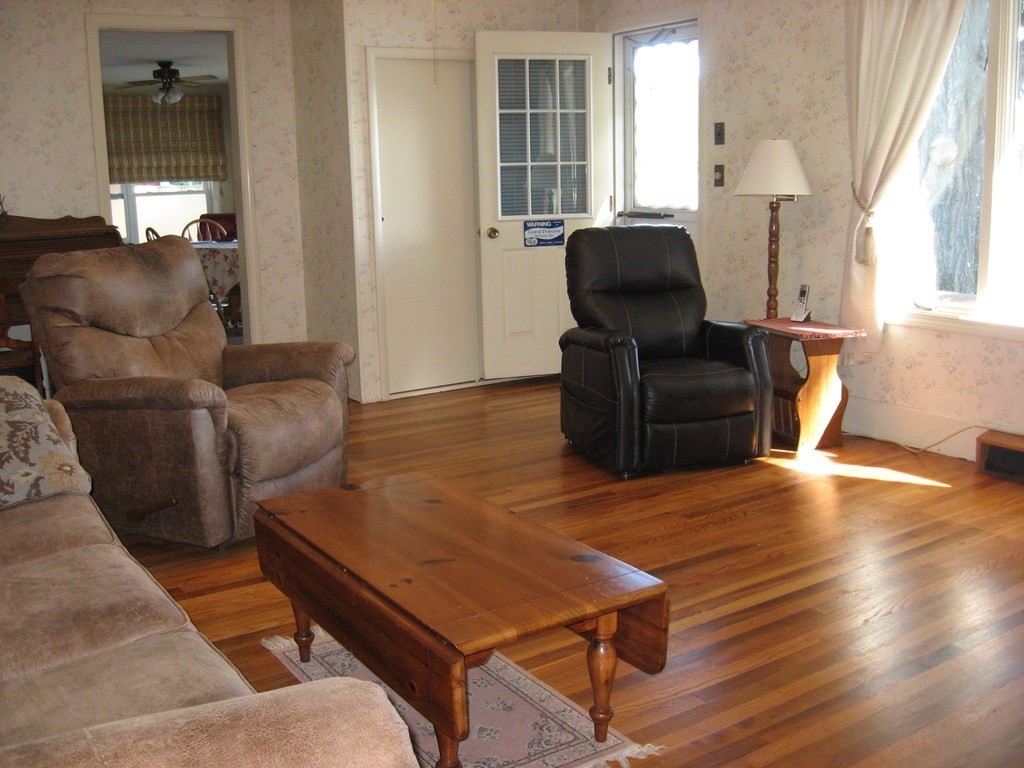 147 Lake Road Brookfield, MA 01506 - Photo 21 of 38 a living room with furniture and wooden floor