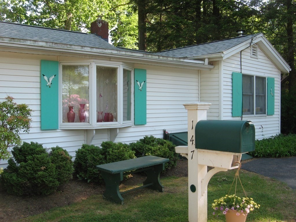 147 Lake Road Brookfield, MA 01506 - Photo 3 of 38 a front view of a house with garden