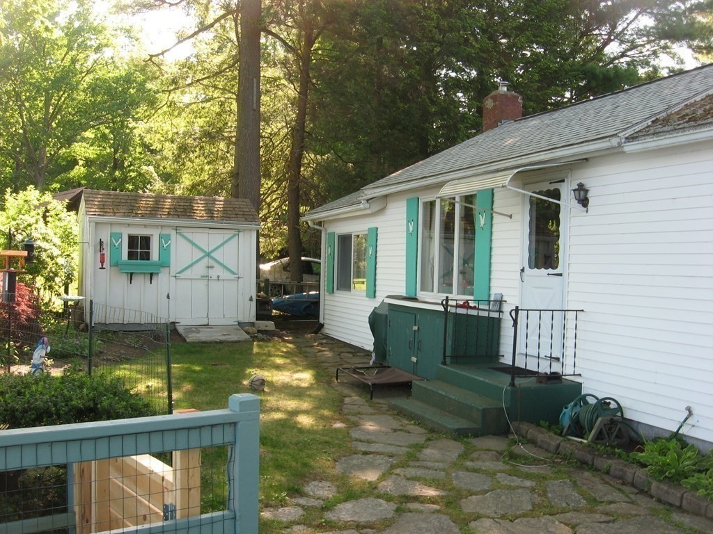 147 Lake Road Brookfield, MA 01506 - Photo 8 of 38 a front view of a house with garden