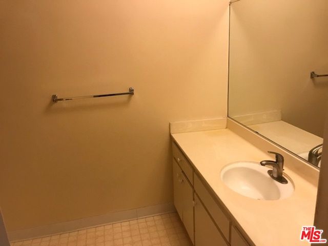 a bathroom with a sink and mirror
