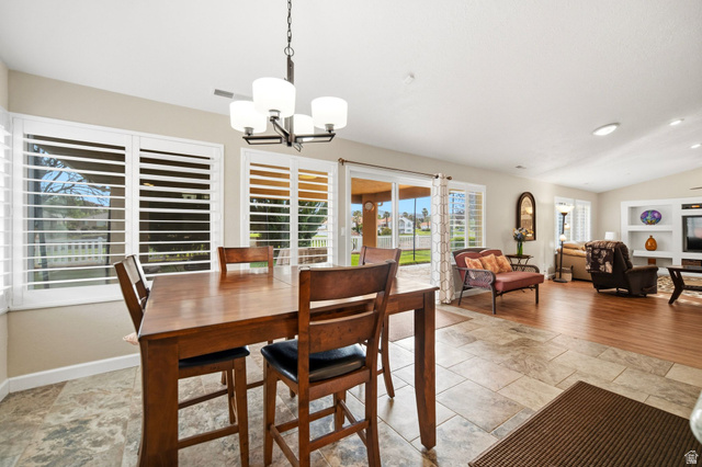 1985 West Rivers Edge Lane St. George, UT 84770 - Photo 18 of 42 Dining area with vaulted ceiling and suspended lighting