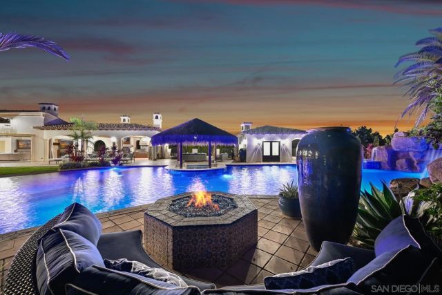 a view of swimming pool with outdoor seating