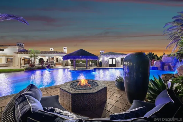 a view of swimming pool with outdoor seating