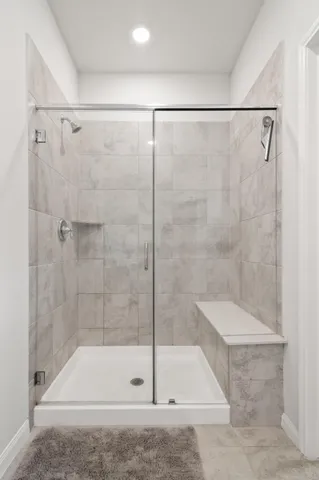 a bathroom with a shower and a bathtub