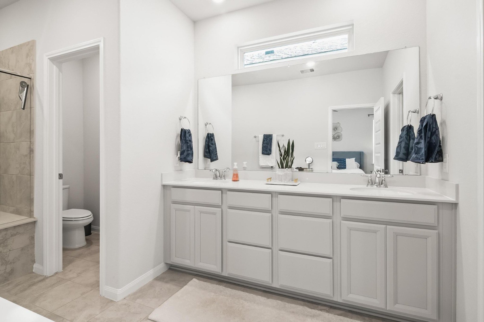 5511 Cuerta Street Houston, TX 77023 - Photo 19 of 25 a bathroom with a double vanity sink and a mirror