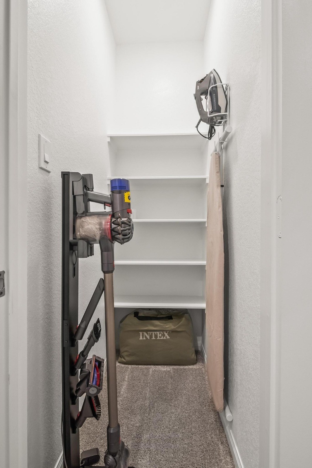 5511 Cuerta Street Houston, TX 77023 - Photo 21 of 25 a view of storage and utility room with racks on the wall