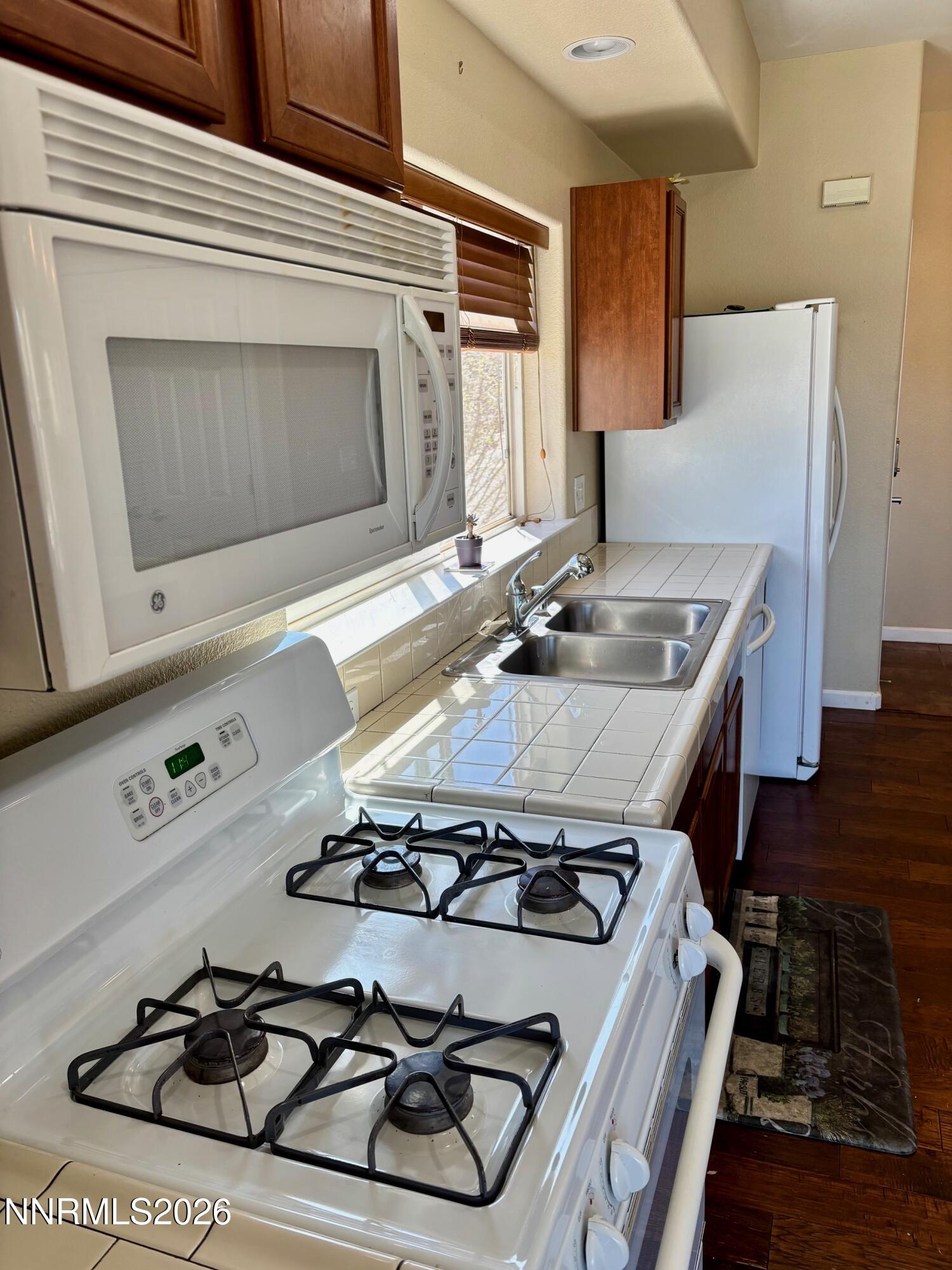 4299 Amber Marie Lane Reno, NV 89503 - Photo 20 of 32 STOVE + SINK + FRIDGE