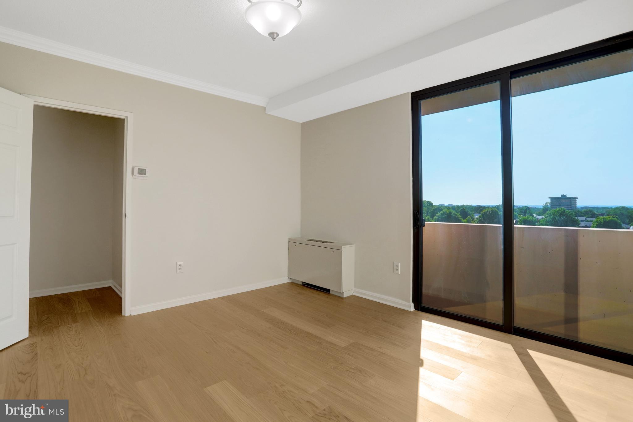 4141 North Henderson Road, Unit 606 Arlington, VA 22203 - Photo 16 of 39 Living Room Access to Balcony