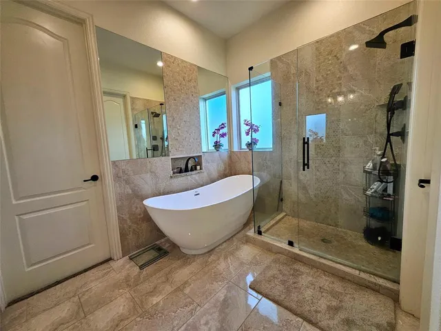 a bathroom with a granite countertop sink mirror and a toilet