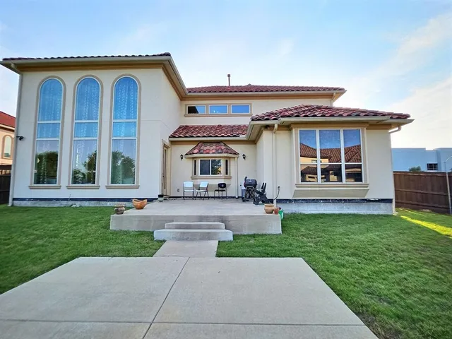 an aerial view of a house with swimming pool