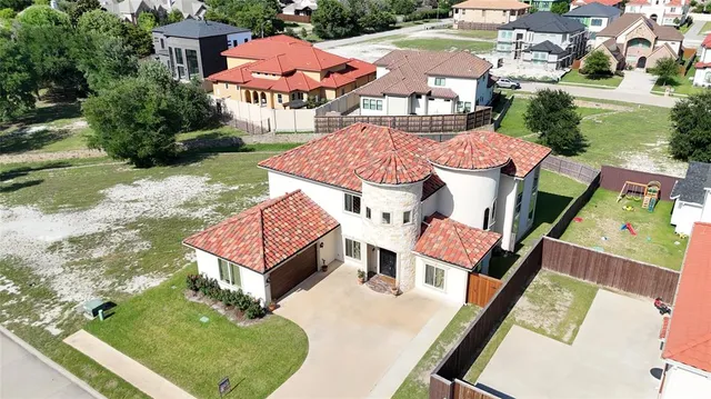 an aerial view of a house with swimming pool