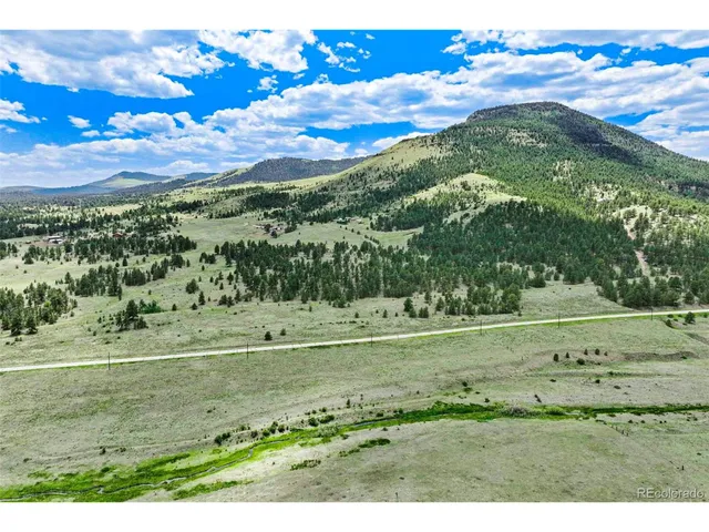 a view of an outdoor space and a mountain