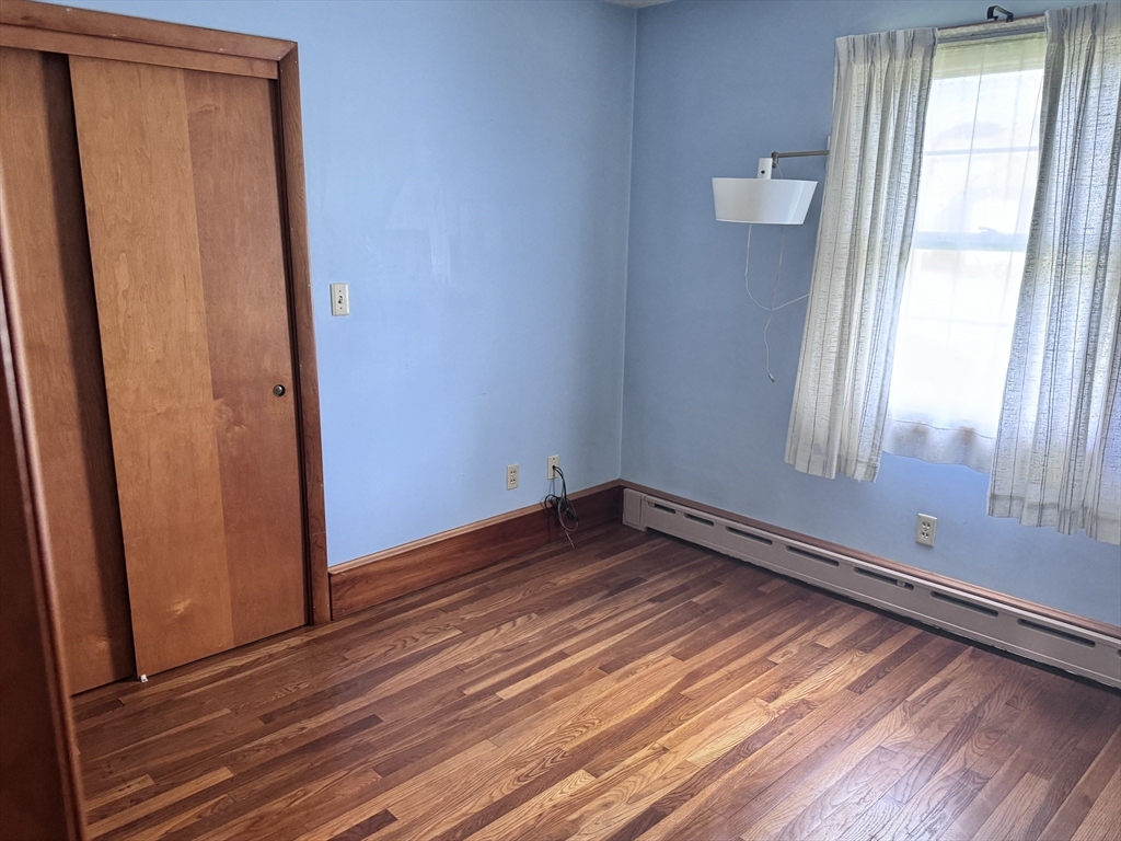 77 Grattan Street Fall River, MA 02721 - Photo 14 of 20 a view of empty room with wooden floor