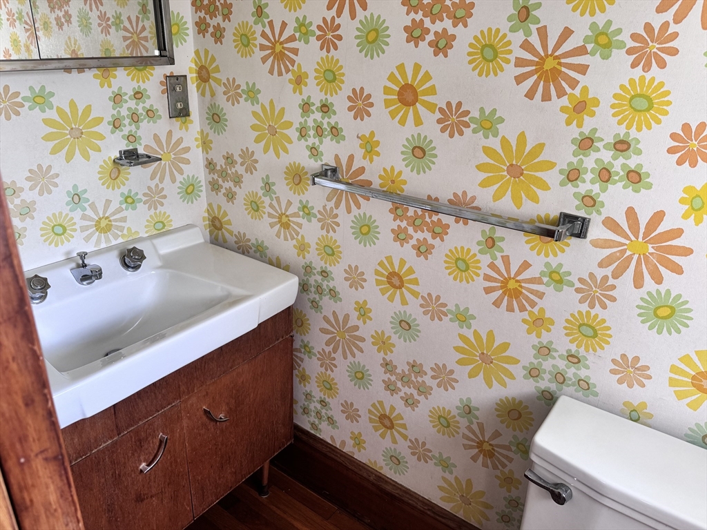 77 Grattan Street Fall River, MA 02721 - Photo 15 of 20 a bathroom with a sink and a mirror
