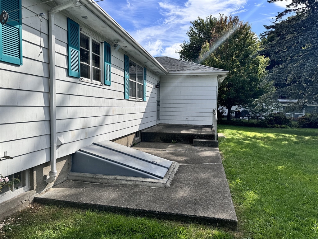 77 Grattan Street Fall River, MA 02721 - Photo 3 of 20 a view of house with backyard space and garden