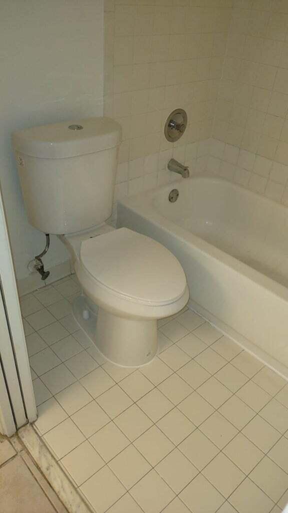 1950 North Congress Avenue, Unit J211 West Palm Beach, FL 33401 - Photo 6 of 7 a bathroom with a toilet and a shower