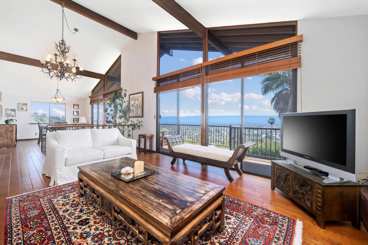34 Rubio Road Santa Barbara, CA 93103 - Photo 6 of 10 a living room with a flat screen tv and a floor to ceiling window