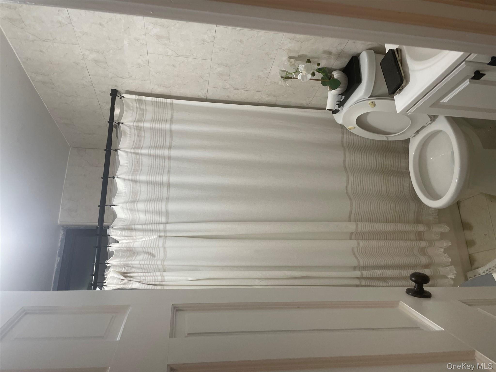 3418 Irwin Avenue Bronx, NY 10463 - Photo 9 of 19 a bathroom with a sink and a toilet