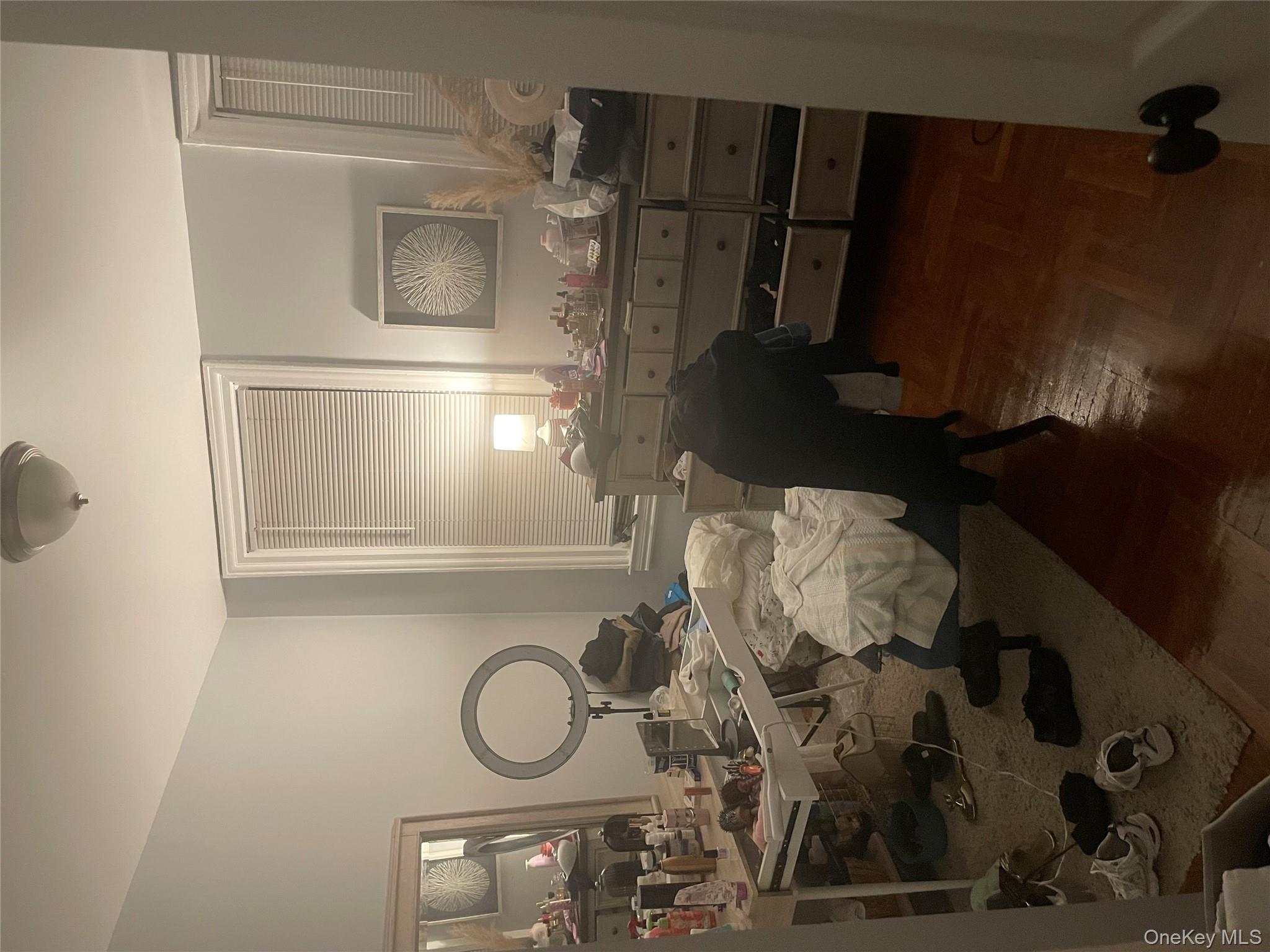 3418 Irwin Avenue Bronx, NY 10463 - Photo 10 of 19 a room with a mirror and furniture
