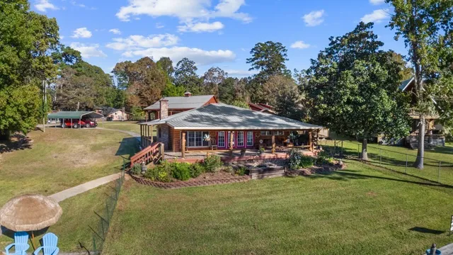 an aerial view of a house with garden space and street view