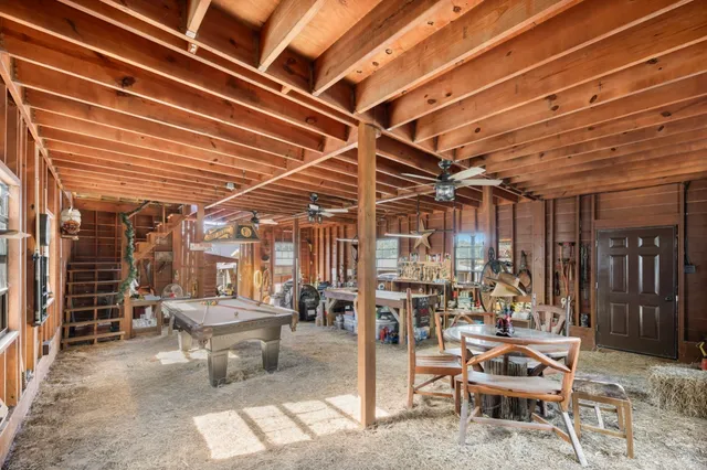 a view of a patio with table and chairs