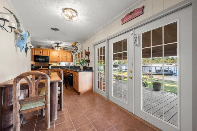 a view of a kitchen with furniture and windows