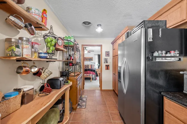 a kitchen with refrigerator and washer