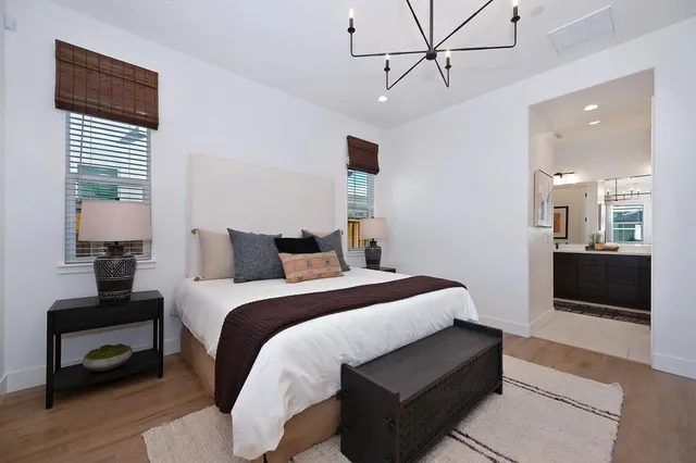 a bathroom with a double vanity sink a mirror and shower