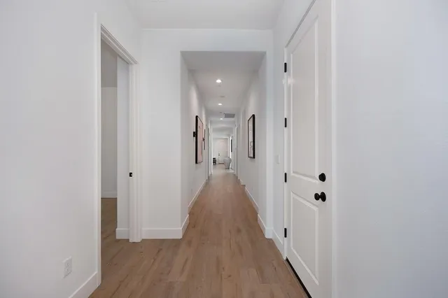 a house with a yard and a wooden fence